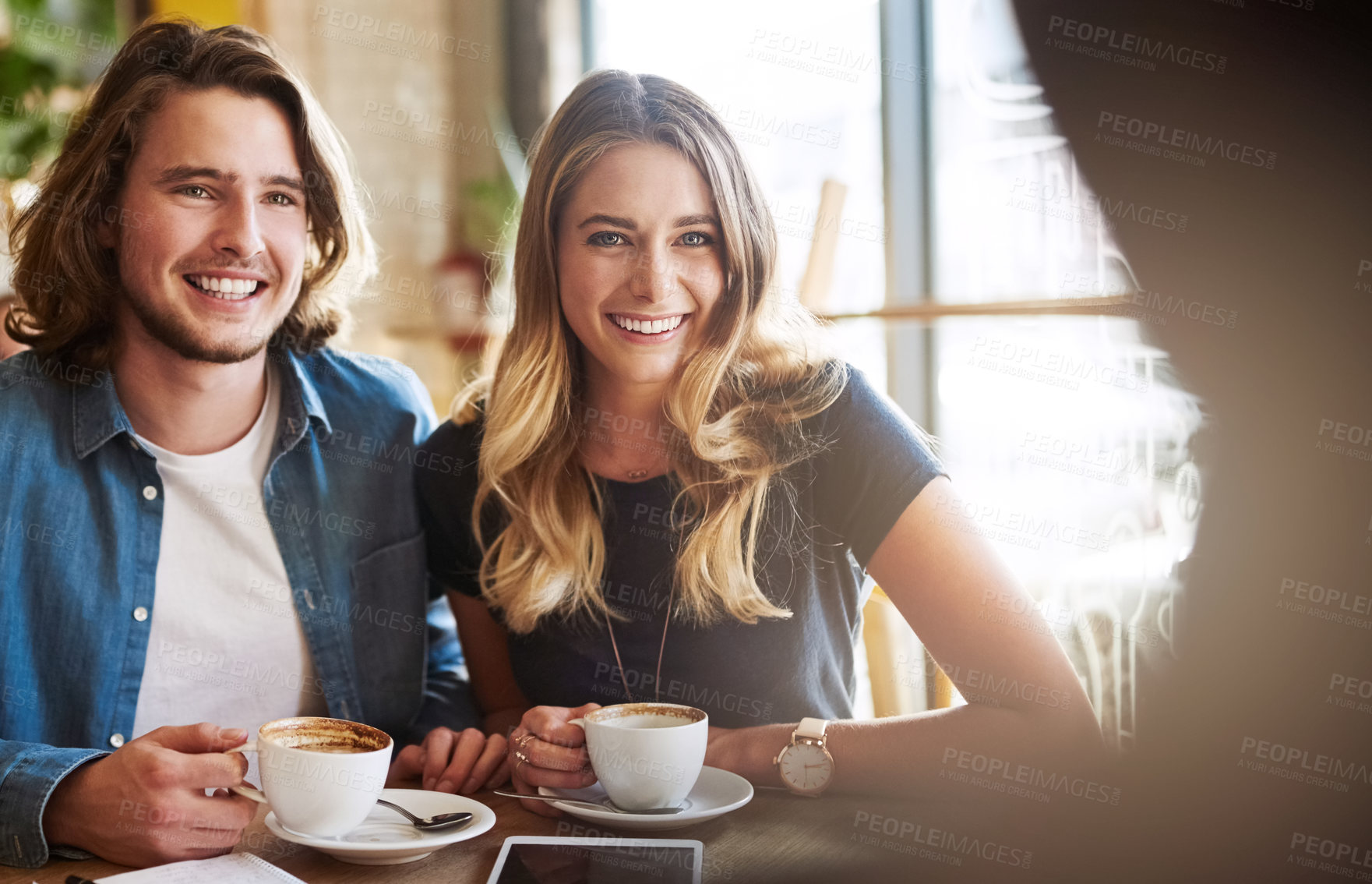 Buy stock photo Cafe, couple and bonding with smile for tea, beverage or discussion for relationship. Coffee shop, woman and man with conversation for dating, commitment or happy people for anniversary with espresso