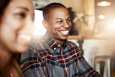 Buy stock photo Shot of a happy young couple in a coffee shop