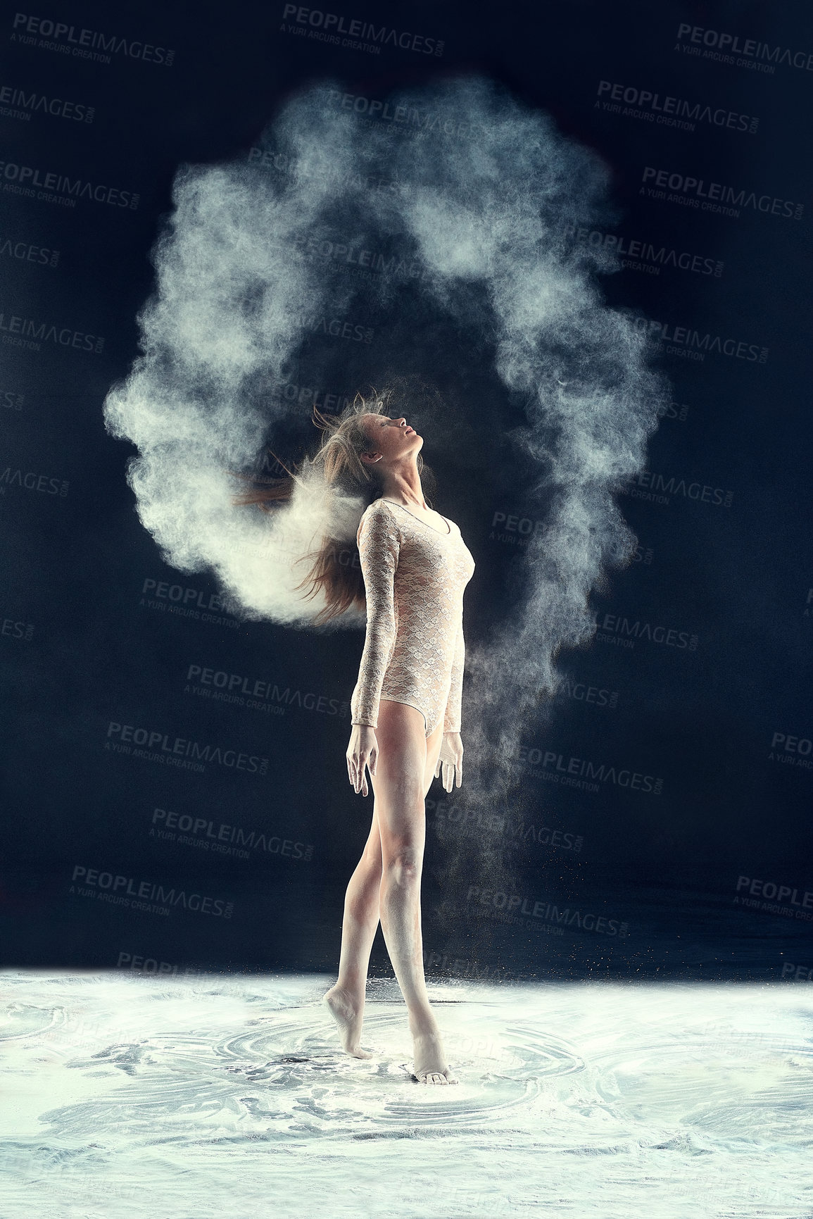 Buy stock photo Studio shot of a young woman leaving a trail of powder in the air by whipping her hair