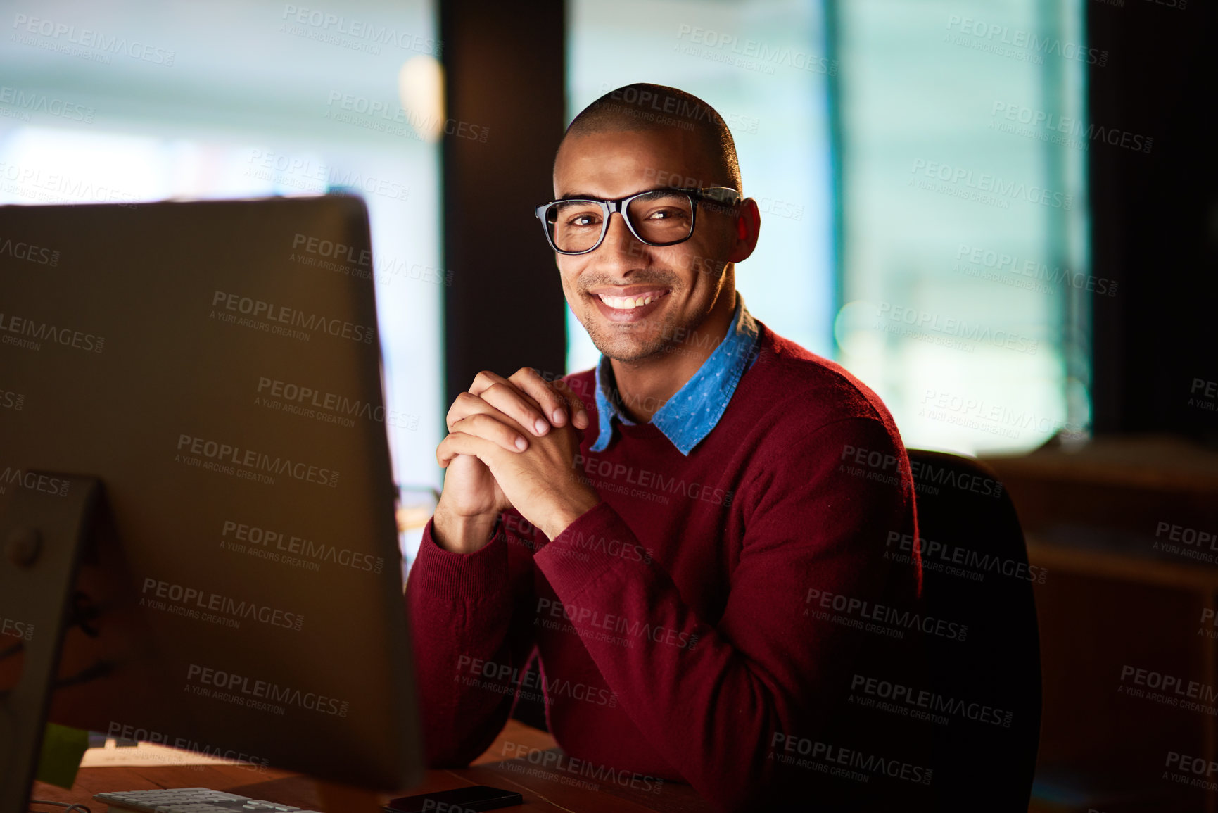 Buy stock photo Night, portrait and happy man with computer, confidence or online project management at agency. Pride, internet research and consultant at desk with business plan, professional career and dark office