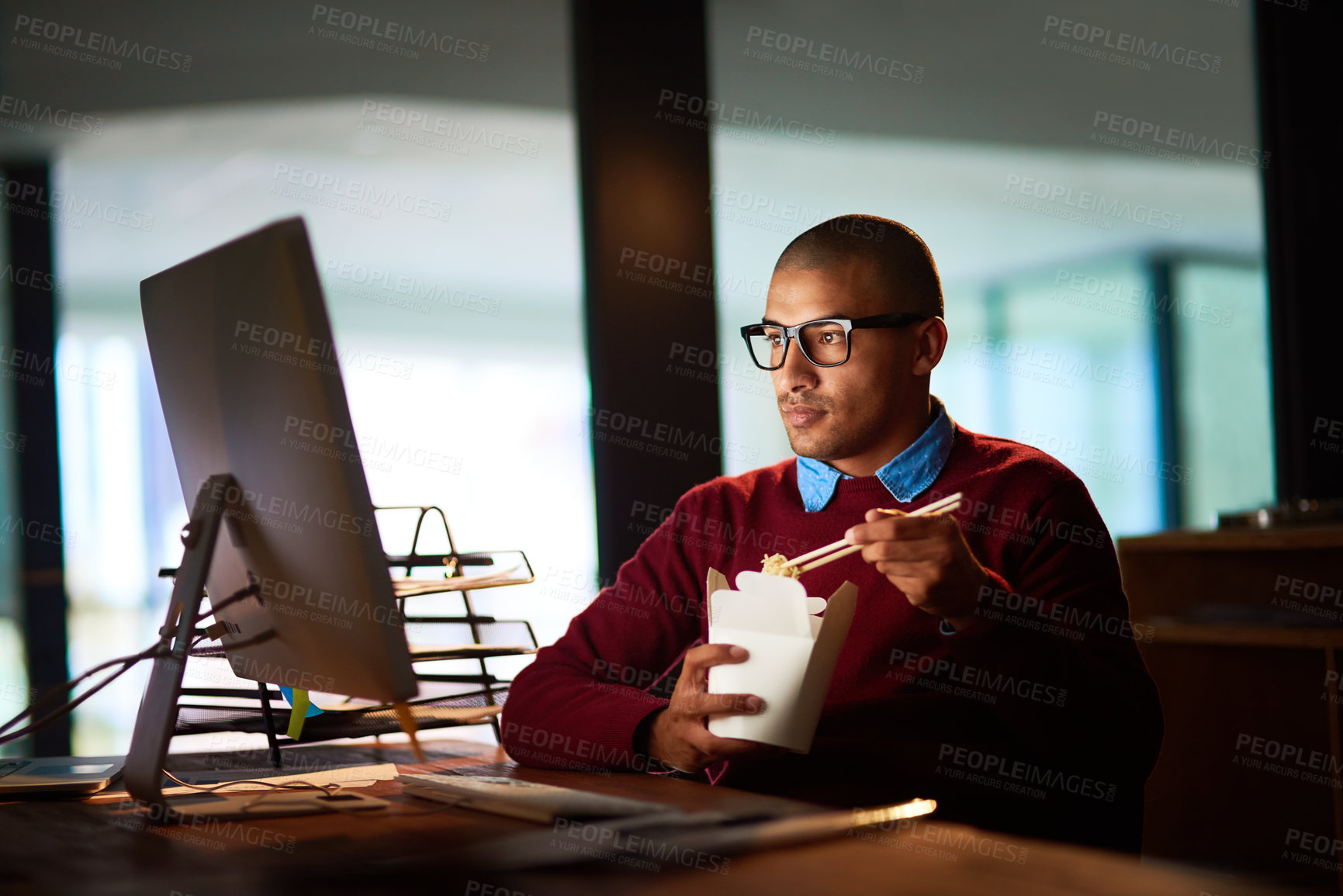 Buy stock photo Late, night and businessman with fast food, computer and research for online project at startup. Reading, internet and consultant eating noodles at desk, checking email or report in dark office