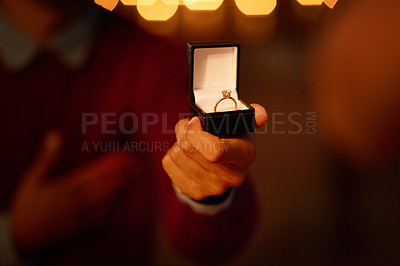 Buy stock photo Cropped shot of an unrecognizable man proposing to his girlfriend