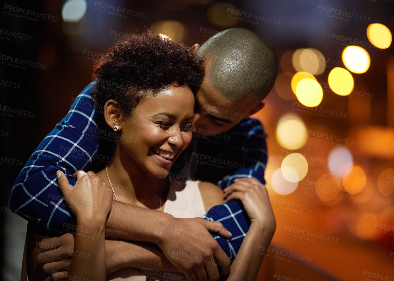 Buy stock photo Happy couple, hug and city travel at night or downtown date for relationship romance, bokeh or evening. Man, woman and embrace in New York for holiday adventure or sightseeing trip, love or marriage