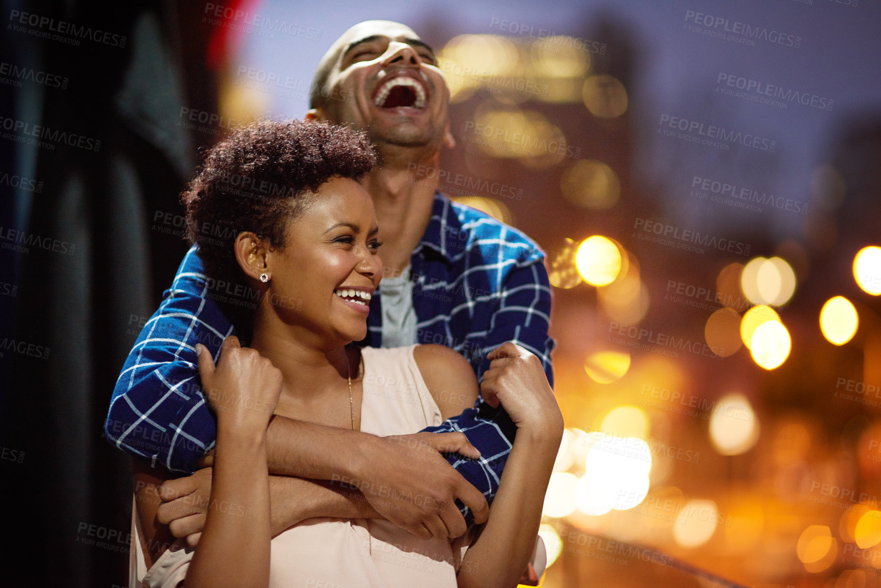 Buy stock photo Cropped shot of an affectionate young couple out on a date in the city