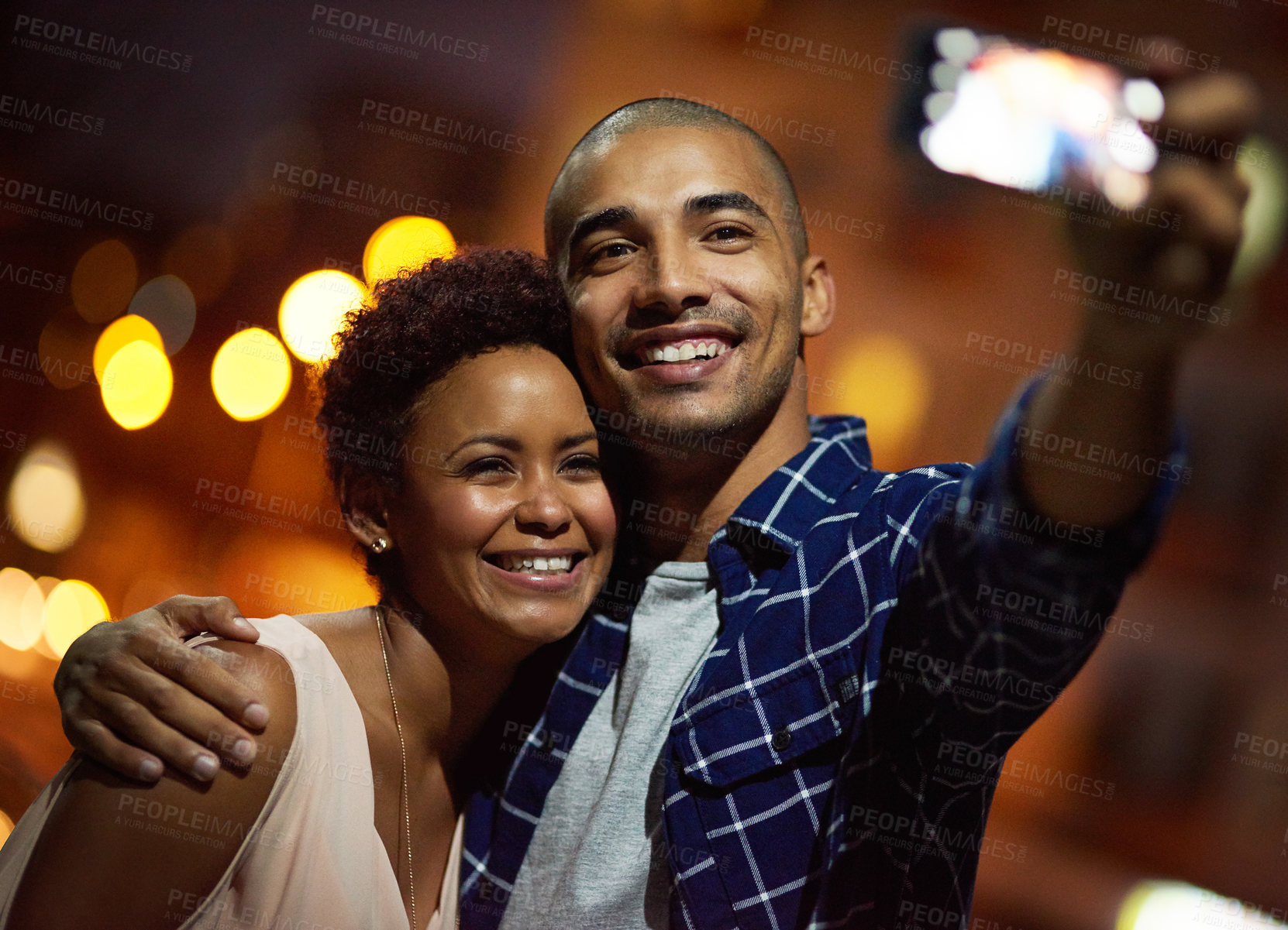 Buy stock photo Happy couple, selfie and city travel at night for social media post or profile picture for sightseeing, memory or bokeh. Man, woman and cellphone in New York on downtown street, tourist or vacation