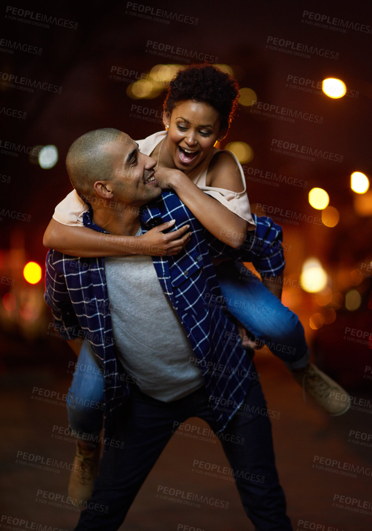 Buy stock photo Piggyback, couple and happy in city at night on adventure or excited to travel on journey together. People, walking and woman with support of partner in marriage, laughing and explore town on date