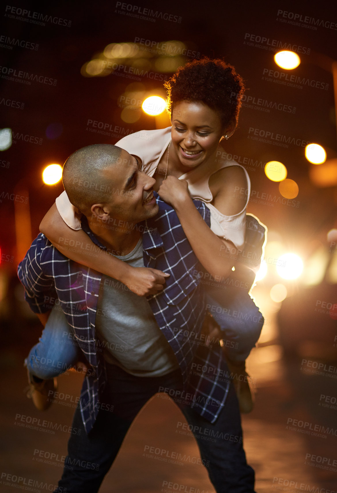 Buy stock photo Cropped shot of an affectionate young couple out on a date in the city
