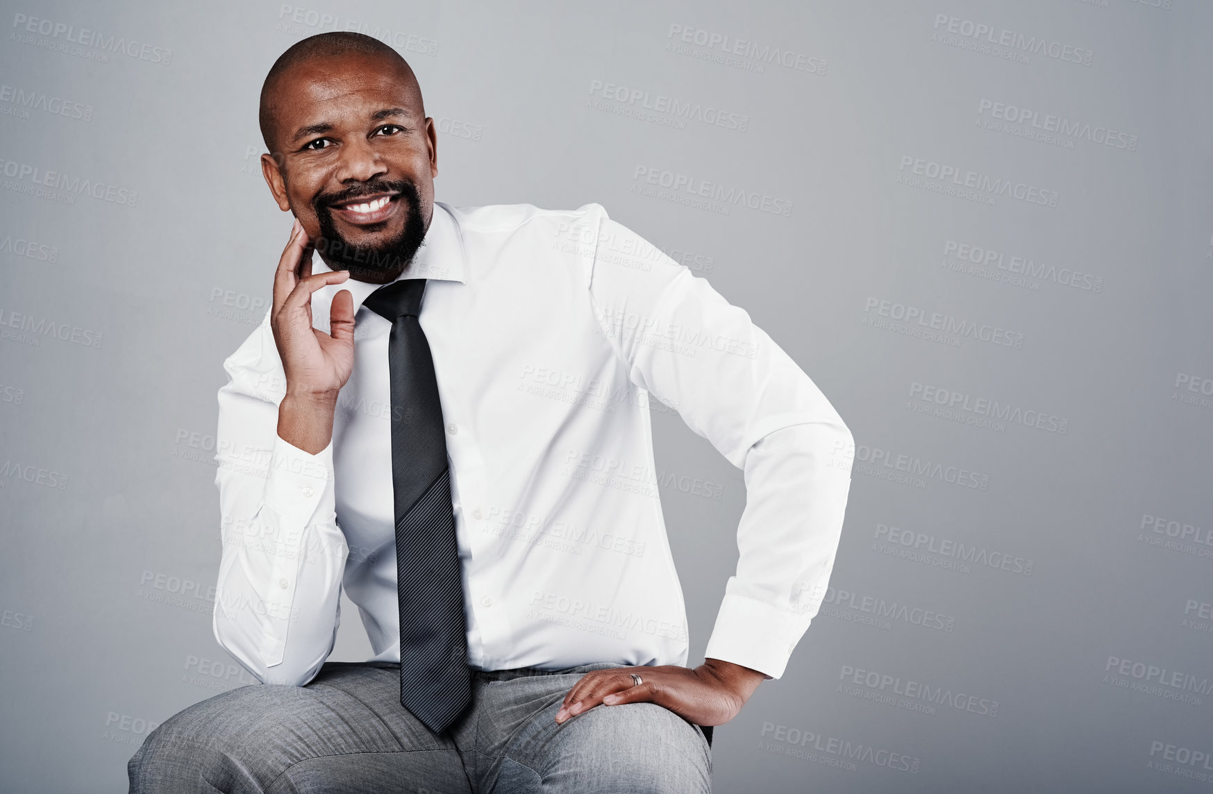 Buy stock photo Portrait, professional and black man with confidence of management consultant in studio. Corporate, entrepreneur and sitting executive with leader and pride from business success with grey background
