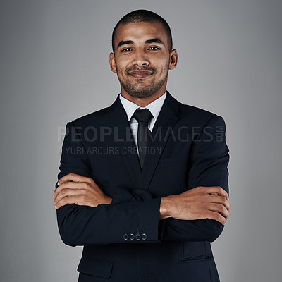 Buy stock photo Studio portrait of a corporate businessman posing against a grey background