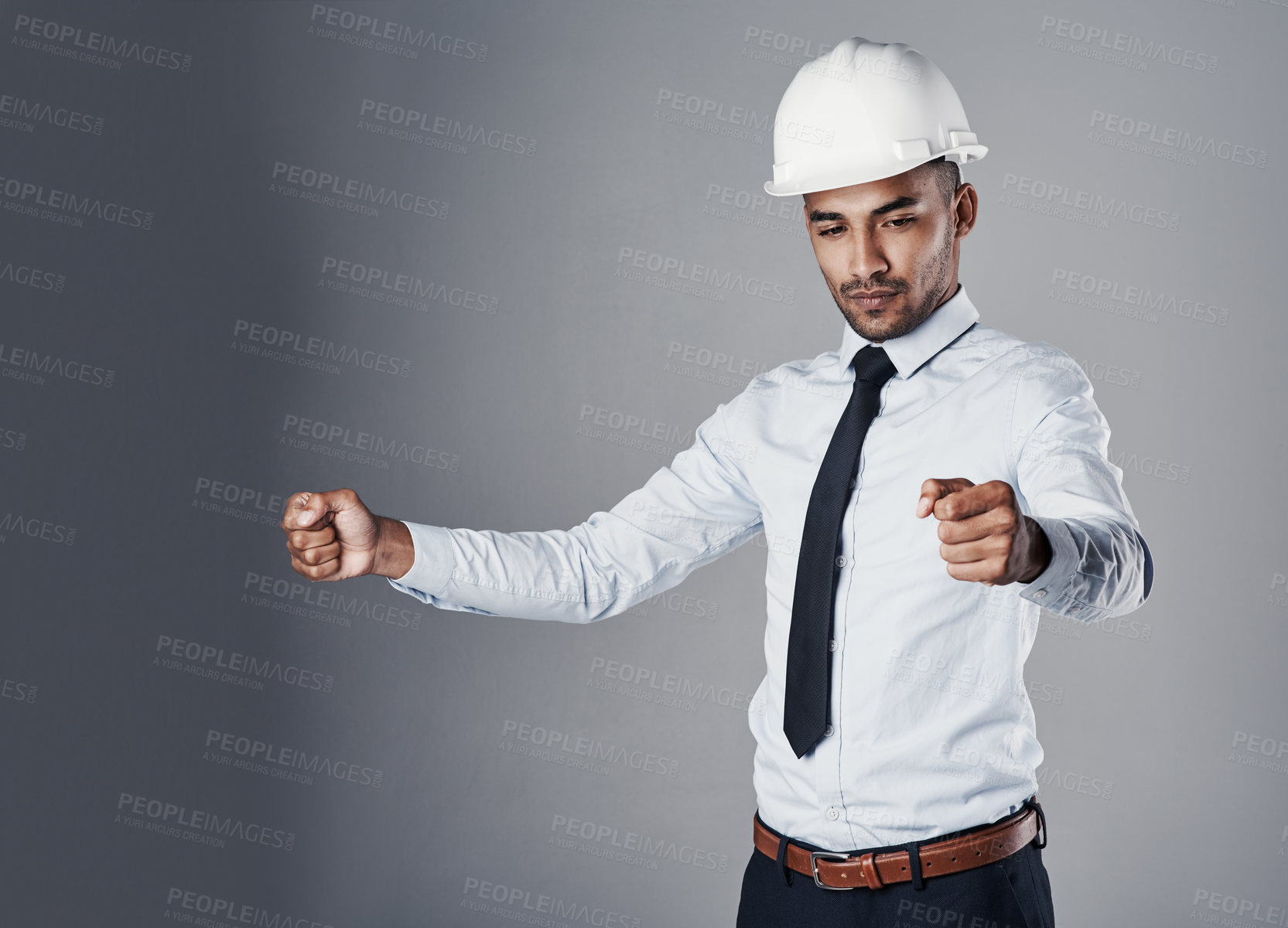 Buy stock photo Pretending, holding and man with invisible document, blueprint of engineer with protection gear in studio. Helmet, manager and civil engineering with contractor and thinking with grey background