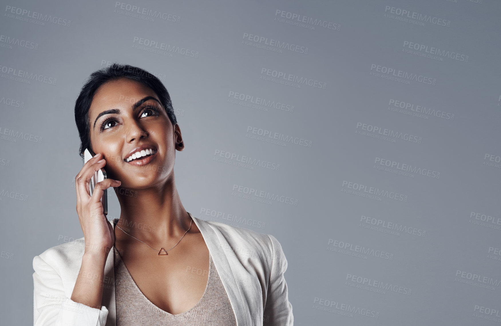 Buy stock photo Phone call, thinking and businesswoman in a studio for communication, ideas and a solution. Technology, cellphone and professional female lawyer on mobile conversation by gray background with mockup.