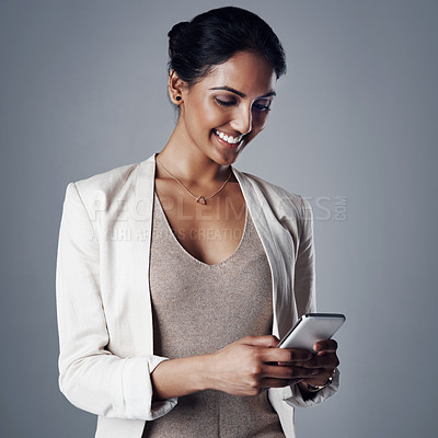 Buy stock photo Corporate, smile and woman with a smartphone, social media and search internet on a grey studio background. Female person, entrepreneur and model with a cellphone, website information and connection