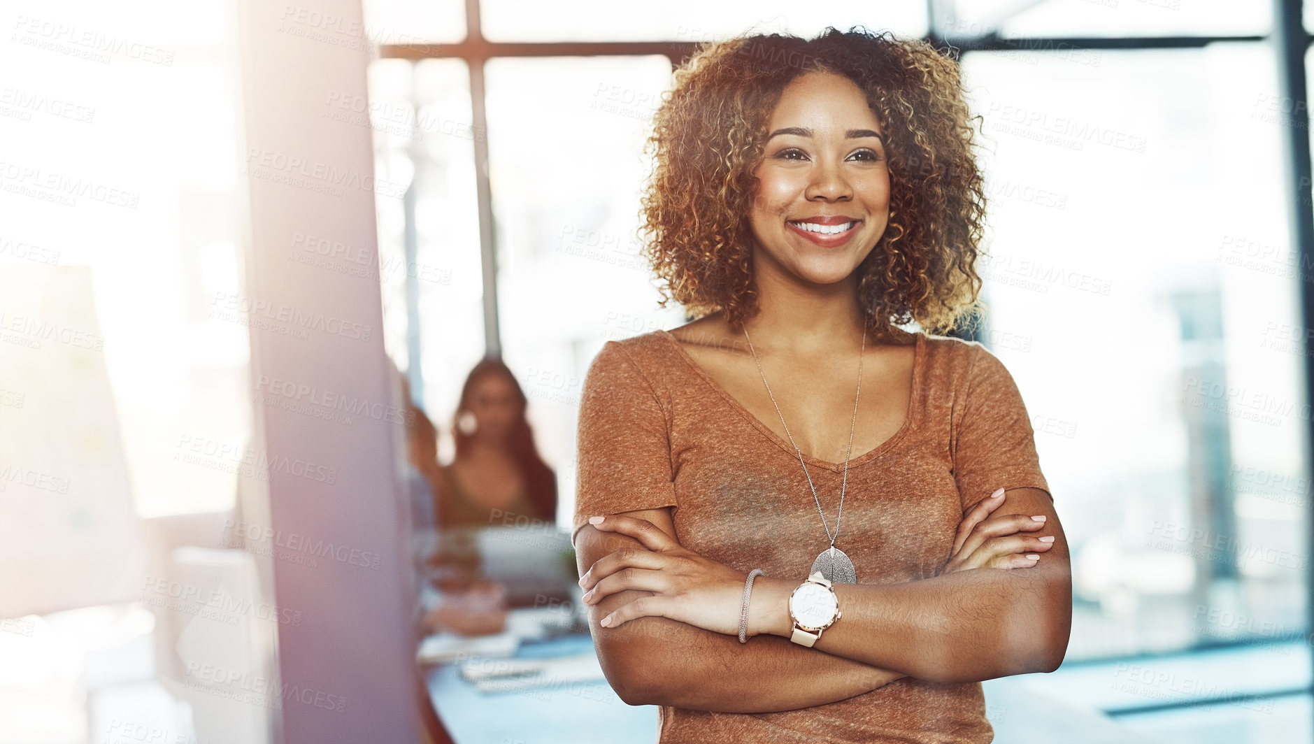 Buy stock photo Shot of a businesswoman posing with her arms crossed in a boardroom