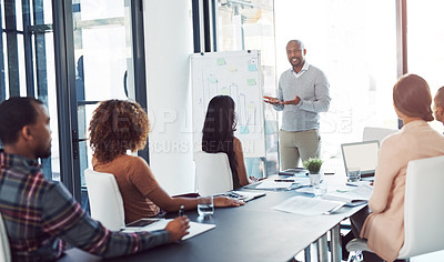 Buy stock photo Creative, office and man at whiteboard for planning, presentation or internship training at agency. Meeting, discussion and business people in conference room for teamwork, strategy ideas or proposal