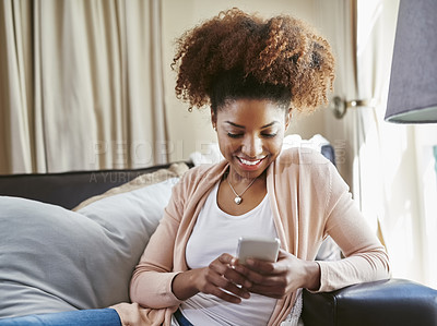 Buy stock photo Home, smile and black woman on couch, smartphone and typing with contact, message and internet. African person, apartment and girl on sofa, cellphone and search for website info with social media