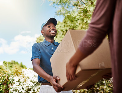 Buy stock photo Shot of a young postal worker delivering a package to a female customer