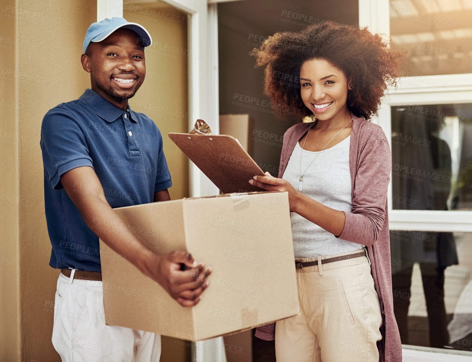 Buy stock photo African delivery man, woman and sign with portrait for package, stock and documents at front door. People, courier and writing with invoice, clipboard and box with customer satisfaction at apartment