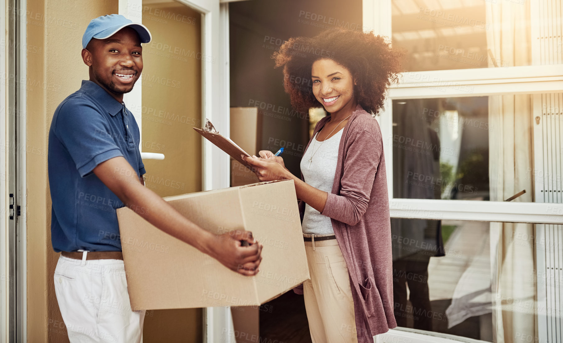 Buy stock photo African delivery man, woman and signature in portrait with package, stock and document at front door. People, courier and writing with invoice, clipboard and box with customer satisfaction at house