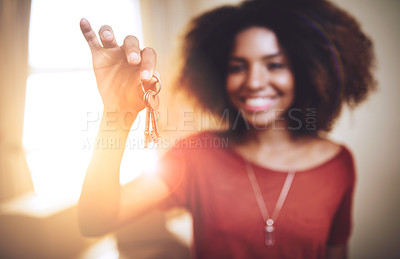 Buy stock photo Portrait of a young woman holding up the keys to a new home