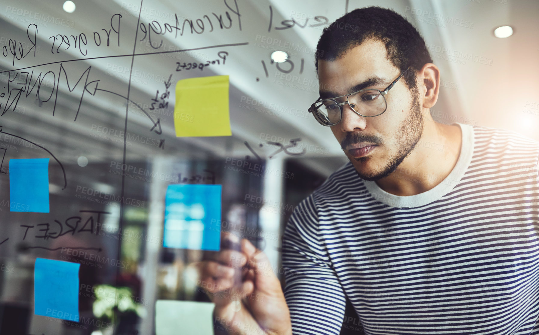 Buy stock photo Businessman, writing or reminder with brainstorming on glass board for agenda or schedule planning at office. Man, creative or employee taking notes for startup project, tasks or ideas at workplace