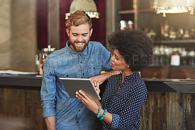 Buy stock photo Man, woman and tablet for management in cafe with discussion, choice and planning menu on app. People, reading and touchscreen for agreement in coffee shop with post on social network for promotion