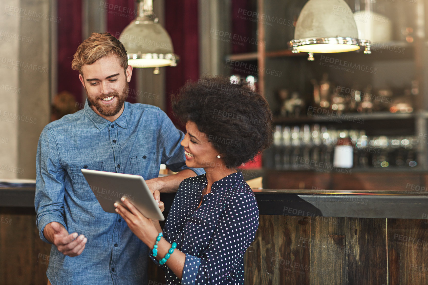 Buy stock photo Man, woman and tablet for partnership in coffee shop with discussion, choice and planning menu on app. People, happy and agreement for post on social media for promotion of restaurant on internet