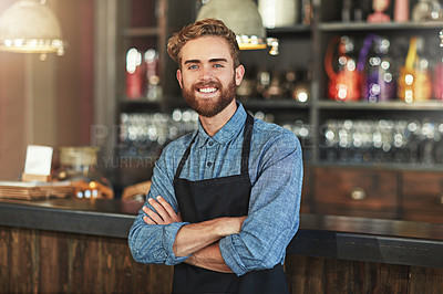 Buy stock photo Happy, smile and portrait of coffee shop owner standing by the counter in his startup cafeteria. Happiness, success and male barista with small business with crossed arms for confidence in restaurant
