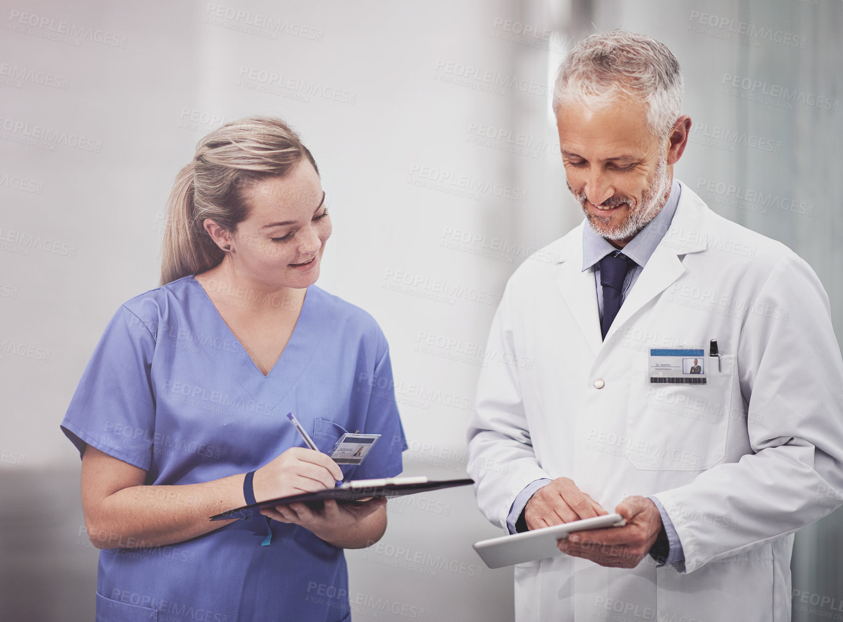 Buy stock photo Cropped shot of two medical practitioners having a discussion in a hospital