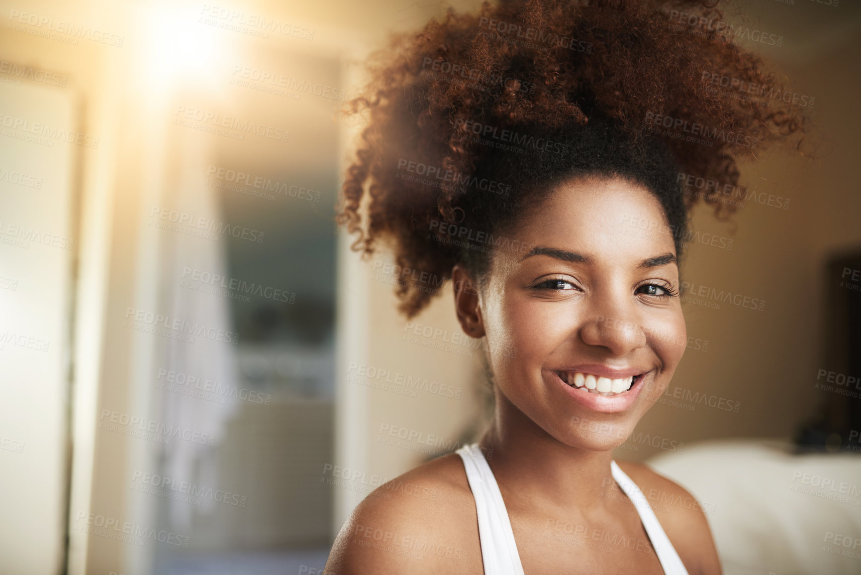 Buy stock photo African woman, portrait and happy in morning in home with mockup space, confidence or natural hair in bedroom. Face, smile in house and pride, waking up or beauty with lens flare in apartment