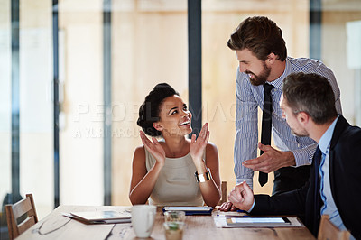 Buy stock photo Portrait of a group of colleagues talking together around a table in an office