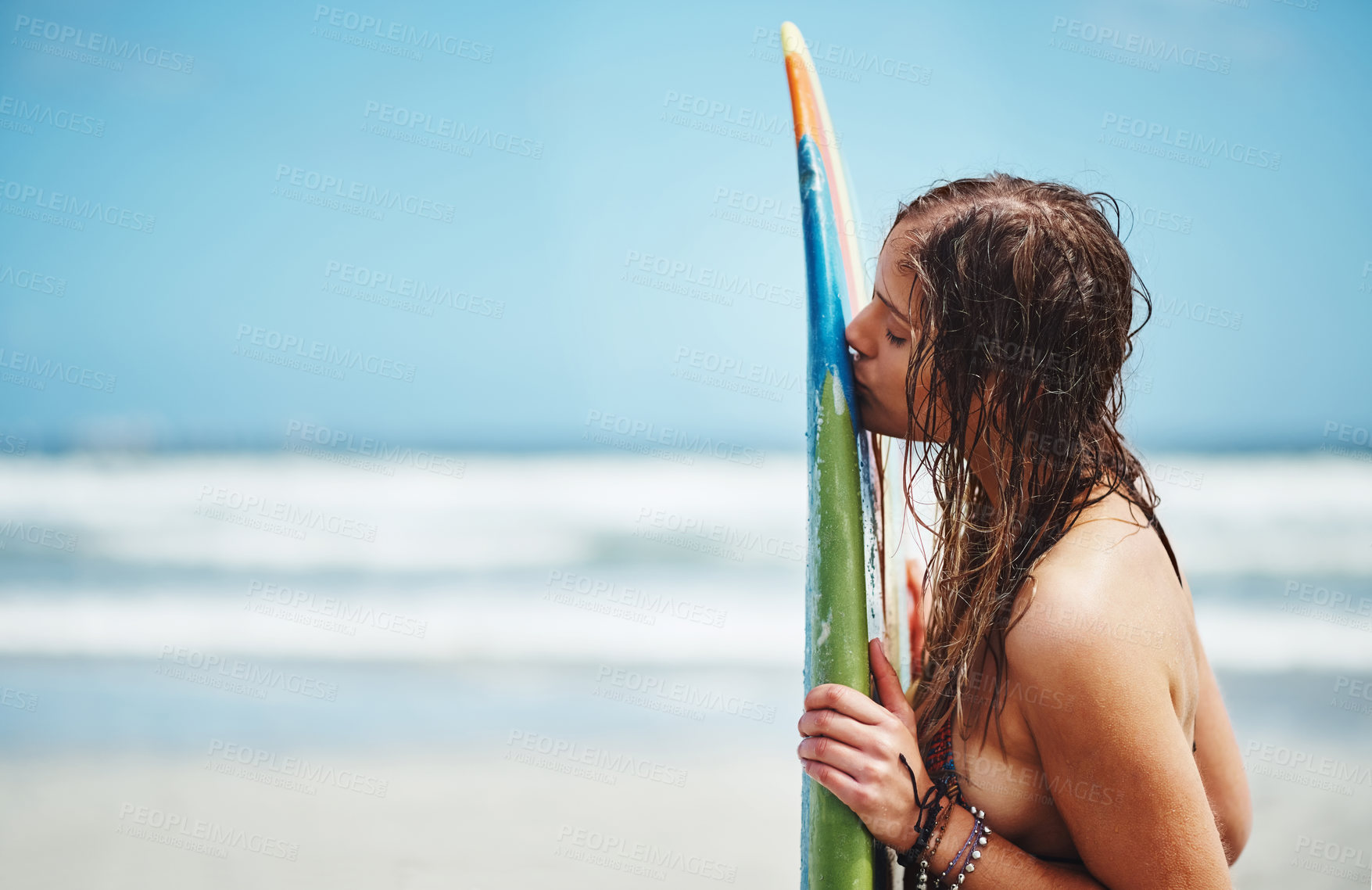 Buy stock photo Woman, naked and kiss surfboard on beach, tropical island and outdoor nature for peace. Female person, nude and sensual desire at sea on weekend trip, water hobby and tourist break on ocean holiday