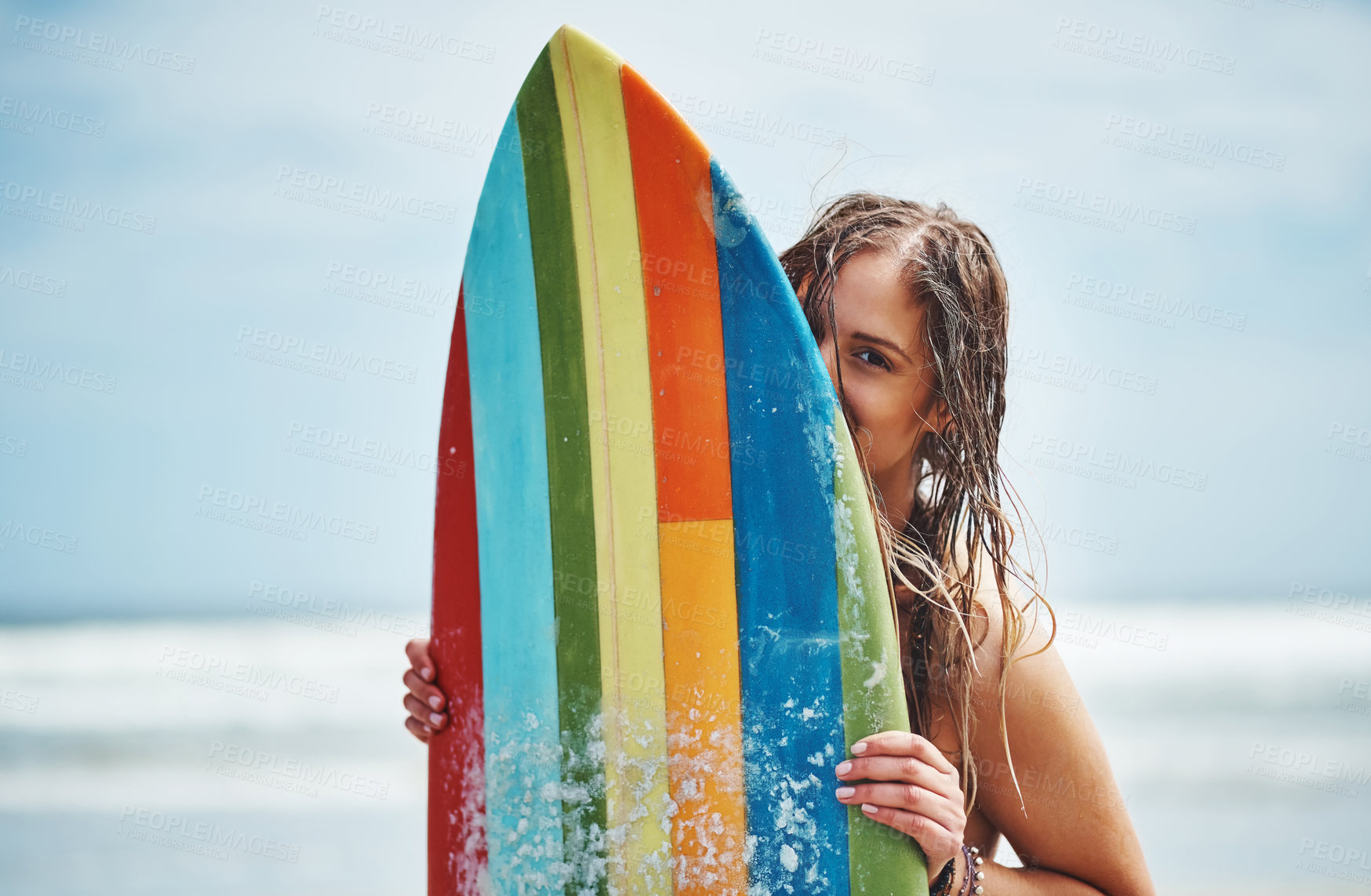 Buy stock photo Woman, portrait and playful surfer on beach, surfboard and outdoor nature for adventure. Female person, tropical island and relax at sea on weekend trip, water hobby and freedom on ocean holiday