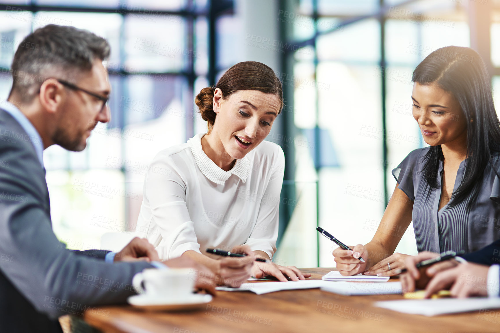 Buy stock photo Business people, negotiation and documents in meeting with team, writing and questions in boardroom. Women, man and happy for agreement with signature, contract and discussion at insurance agency
