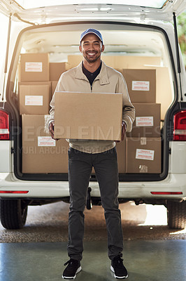 Buy stock photo Portrait of a delivery man unloading boxes from his van