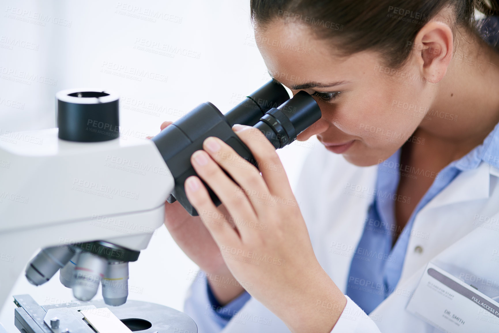 Buy stock photo Scientist, clinic and studying with laboratory, microscope and medical for research and discovery. Woman, science and lab coat for forensics, breakthrough and drug innovation and life extension