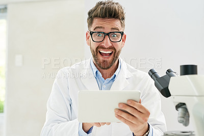 Buy stock photo Portrait of a male scientist looking excited while working in a lab