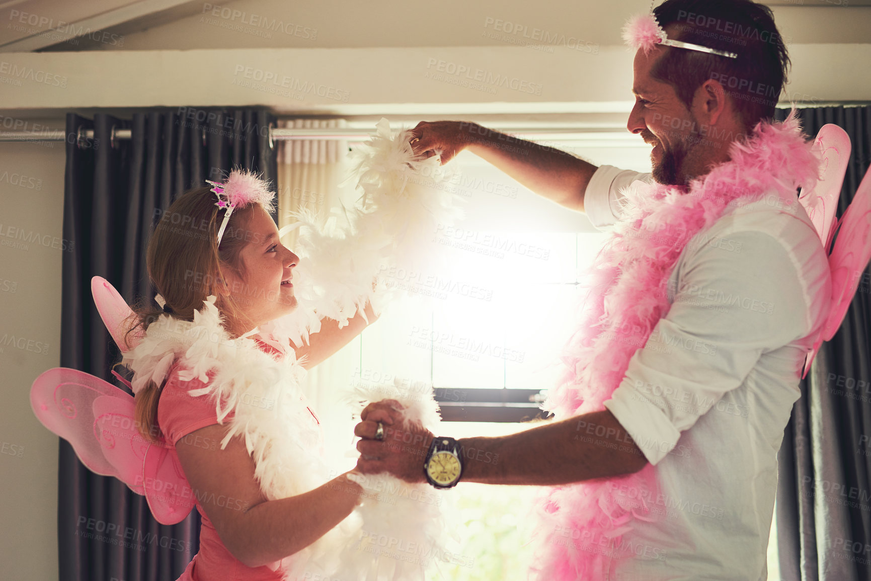 Buy stock photo Cropped shot of a father and his little daughter having fun at home