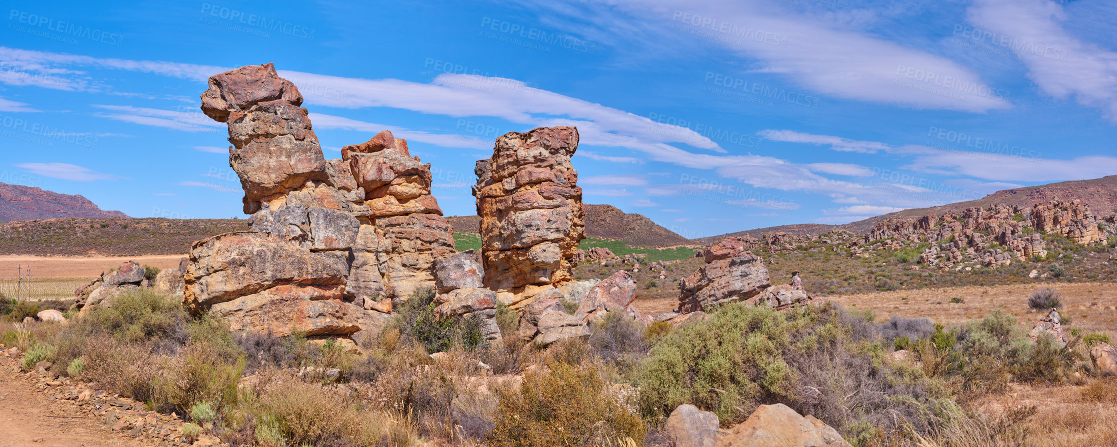 Buy stock photo Rock, blue sky and landscape in nature with bushes, ecosystem and natural habitat in banner. Boulder formation, plants and sunshine in environment with dry climate, travel or stone in Arizona reserve