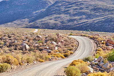 Buy stock photo Landscape, mountains and rocks with road in nature for environment, horizon and earth. Sustainability, plants and tourism with outdoor path for travel, habitat conservation and hills background