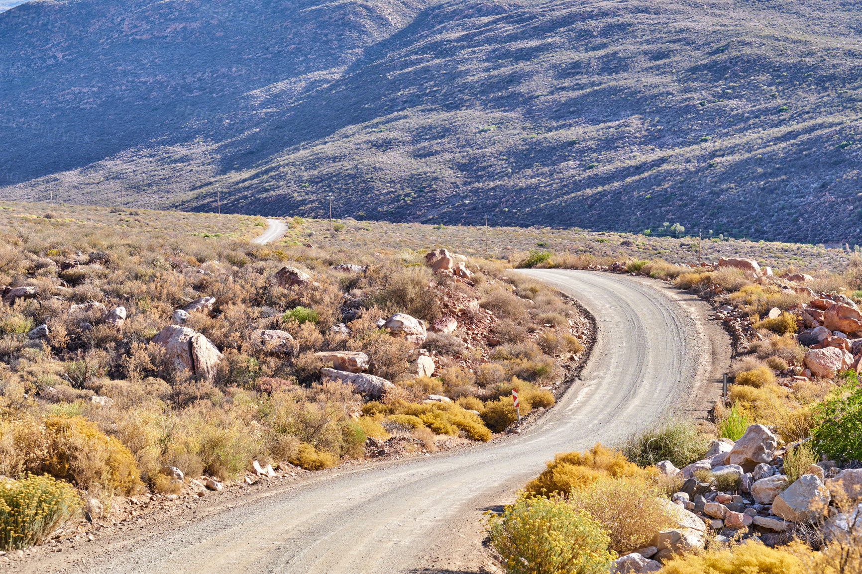 Buy stock photo Landscape, mountains and rocks with road in nature for environment, horizon and earth. Sustainability, plants and tourism with outdoor path for travel, habitat conservation and hills background