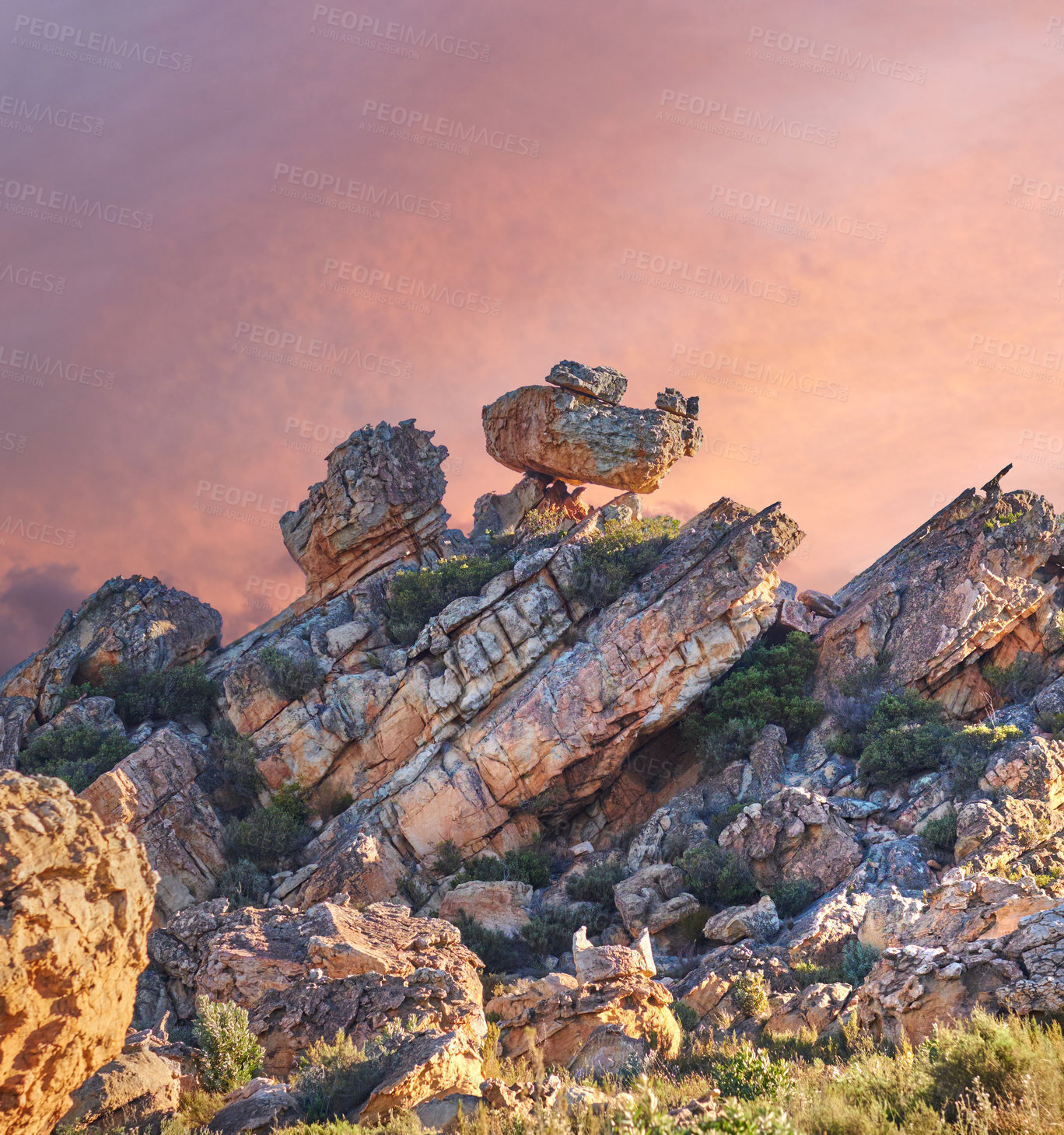 Buy stock photo Rock, sunset sky and landscape in nature with plants, ecosystem and habitat creation in wallpaper. Boulder, formation and bushes in environment with dry climate, travel and stone in Arizona reserve