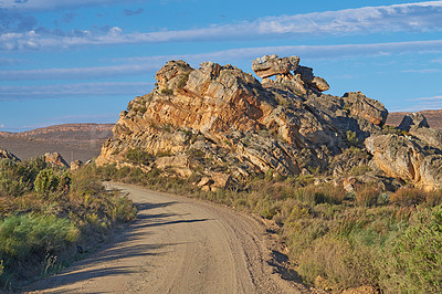 Buy stock photo Dirt road, mountains and environment with nature, blue sky and adventure with journey. Empty, travel and hills with Australia desert, getaway and plants with landscape, arid and countryside with 