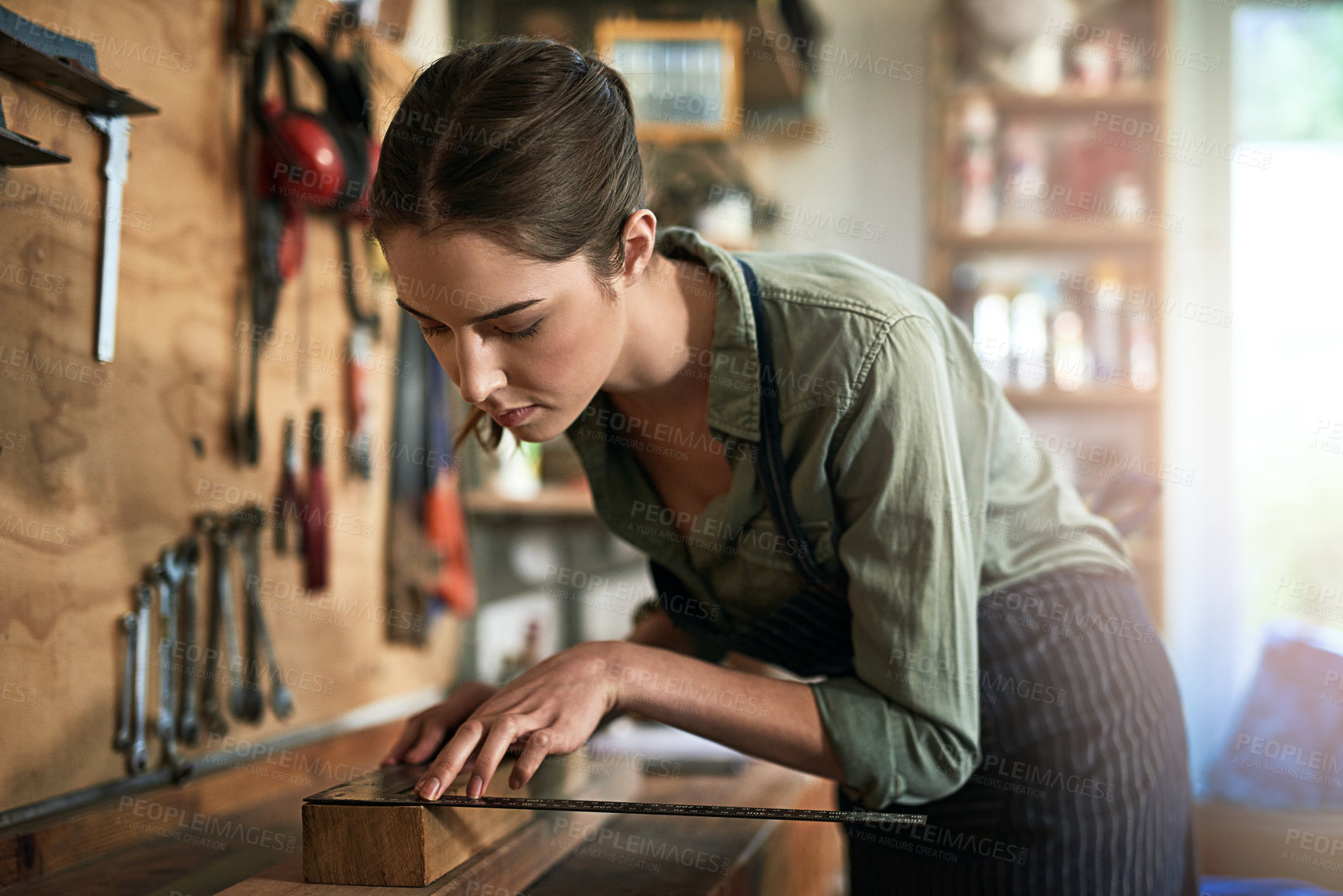 Buy stock photo Shot of a young female designer in her workshop