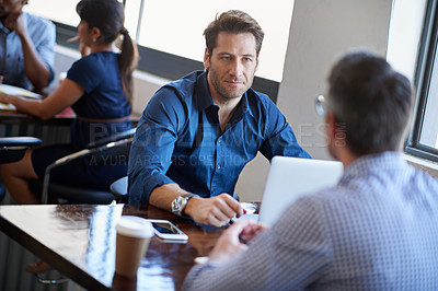 Buy stock photo Cropped shot of two businessmen talking in an office