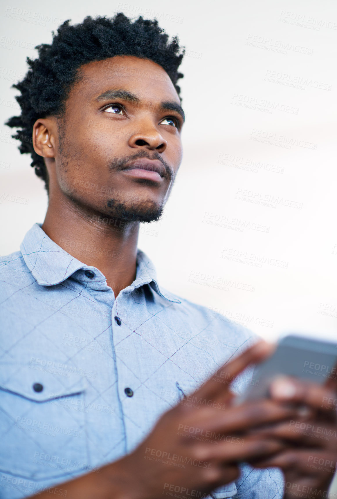 Buy stock photo Online, typing and black man with phone to search for info and thinking of post on social media. Creative, businessman and planning with smartphone reminder app, notes and remember ideas for project