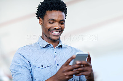 Buy stock photo Shot of a handsome young businessman sending a text message