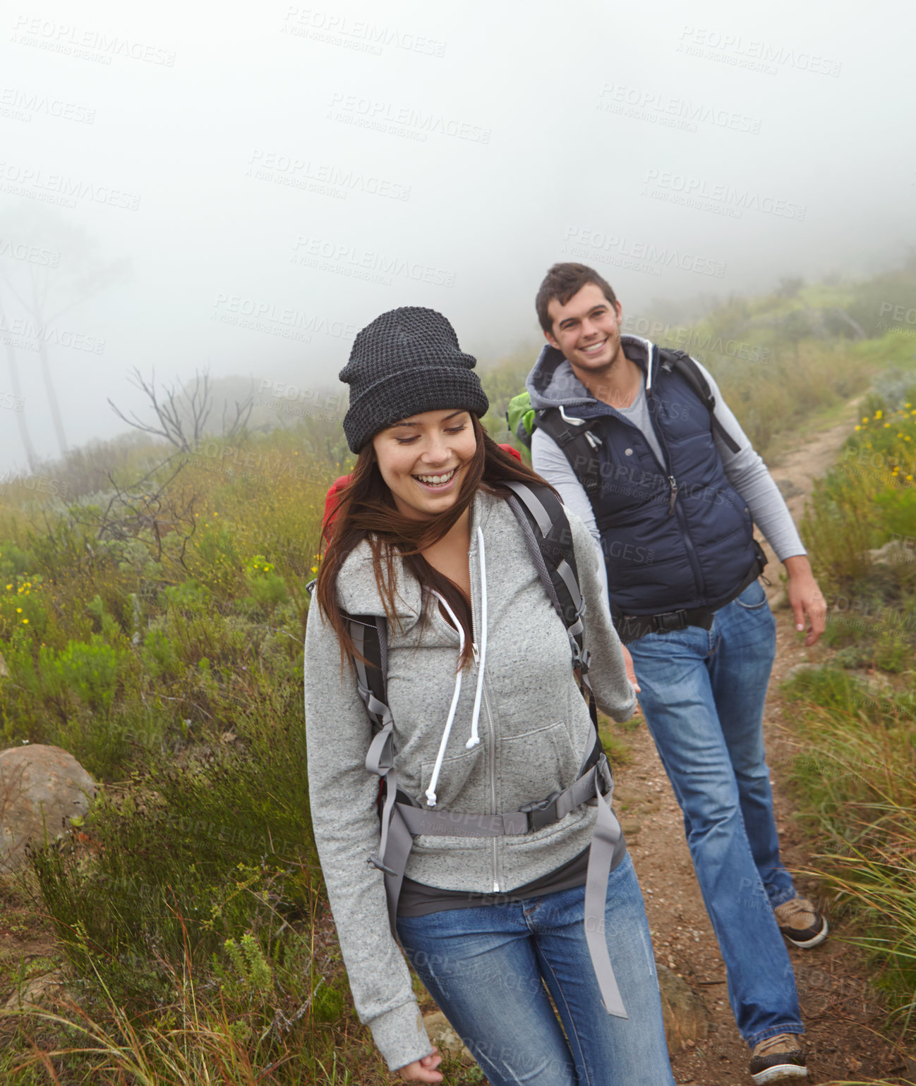 Buy stock photo Shot of a beautiful young woman out hiking with her boyfriend