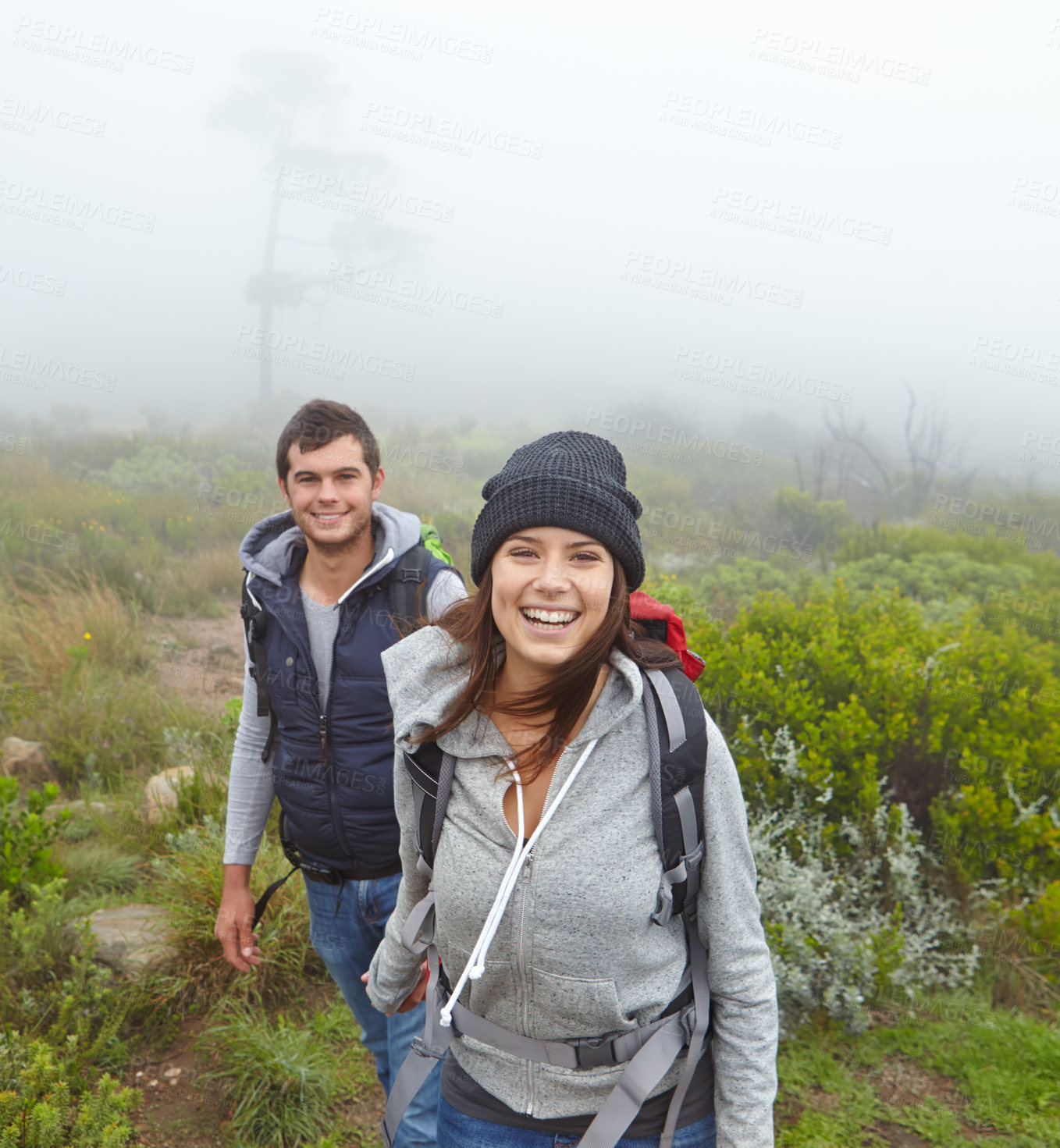 Buy stock photo Shot of a beautiful young woman out hiking with her boyfriend