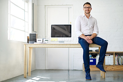 Buy stock photo Full length portrait of a businessman sitting a desk in his office