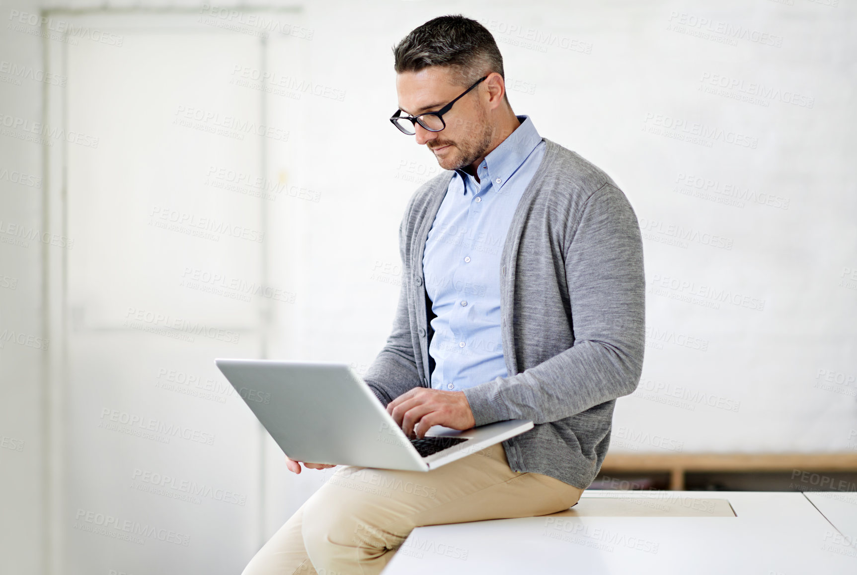 Buy stock photo Laptop, office and man on desk working for it support in startup company for project. Reading, pride and male software engineer with computer for troubleshooting online for cloud computing systems.